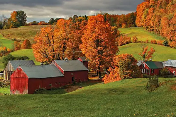 Vermont red barn and hills with fall foliage
