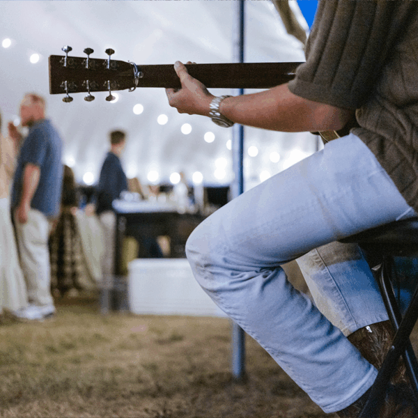 Upclose of person playing guitar