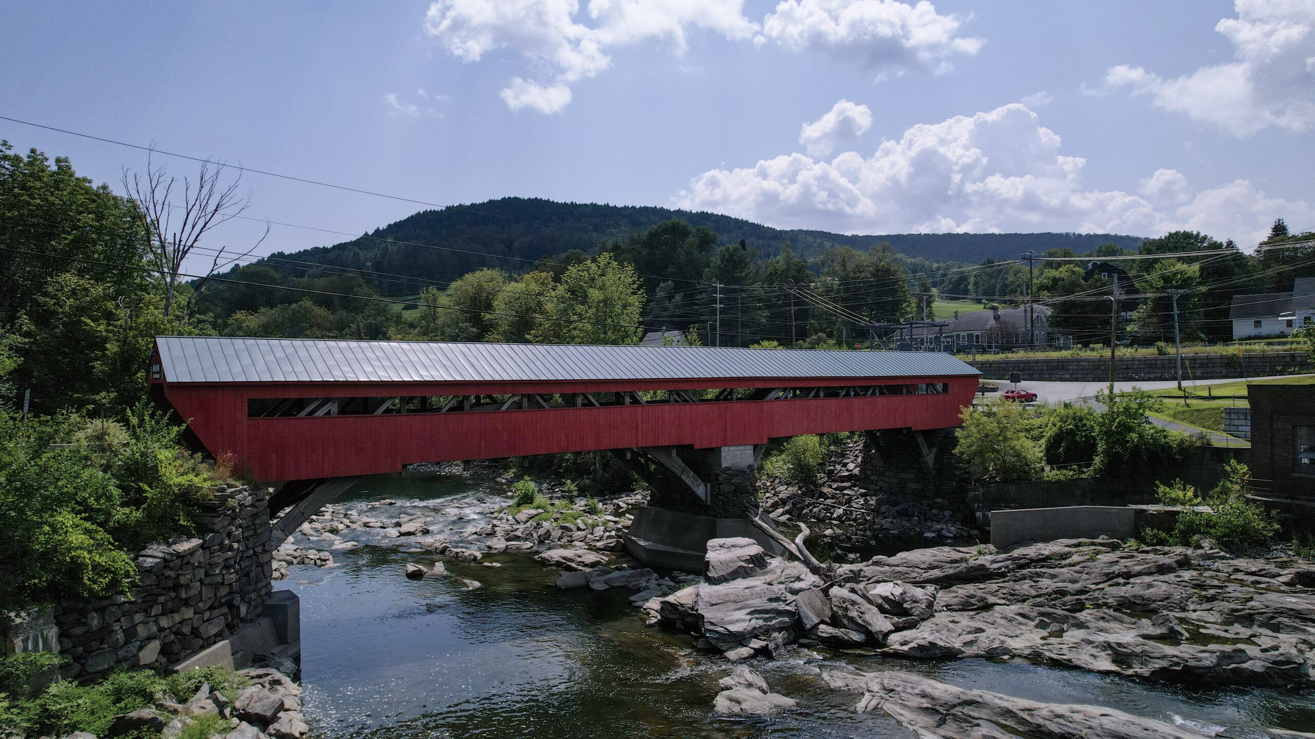 Red Covered Bridge over River in Woodstock, VT